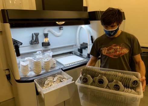 Printed parts of printed respirators taken out by the operator from the post-processing station